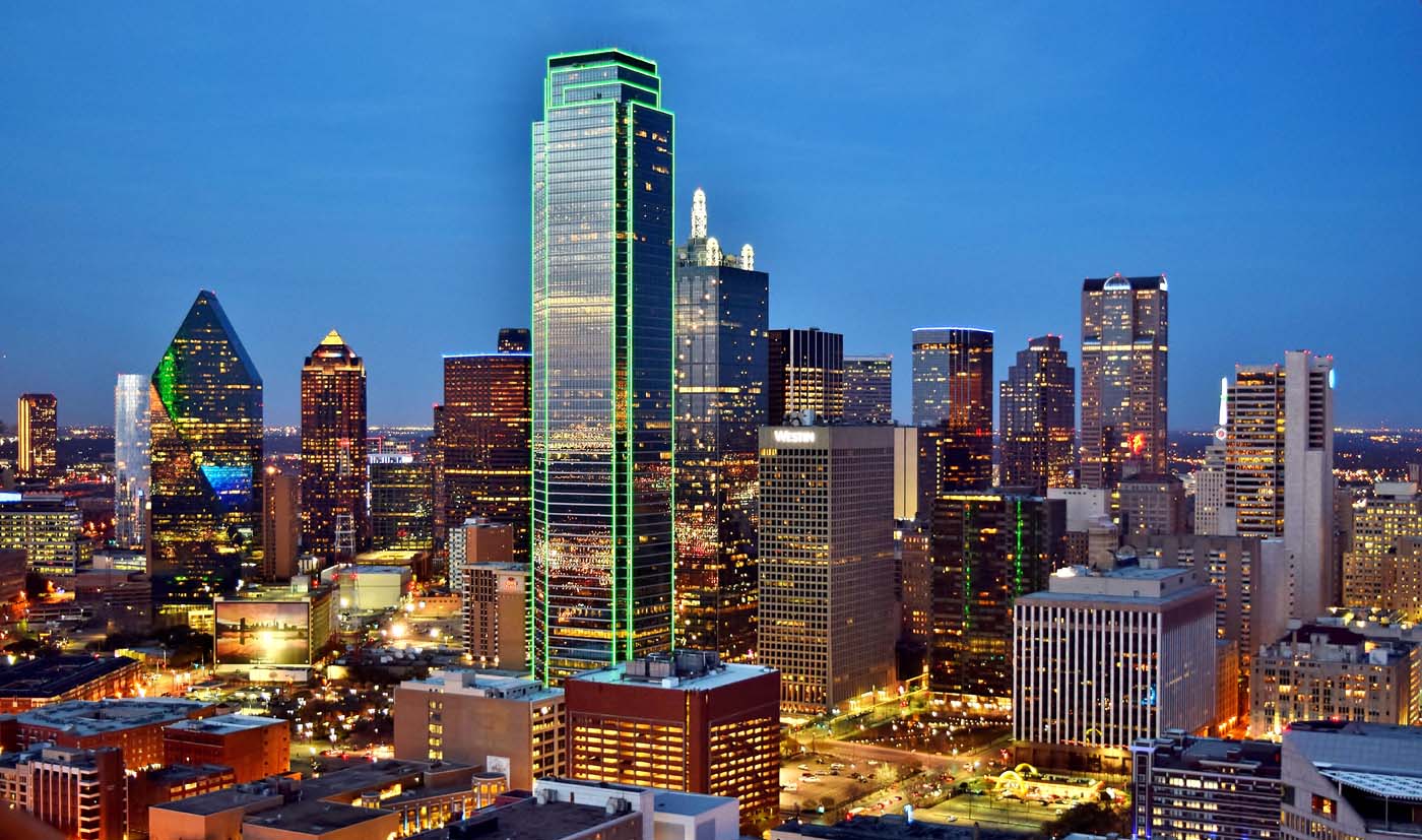 texas commercial real estate buildings in dallas view at dusk with buildings lights on