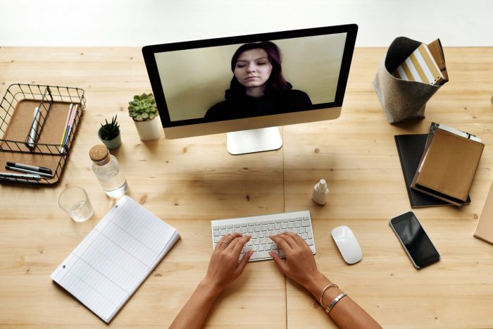 woman does video call with colleague at offices.net