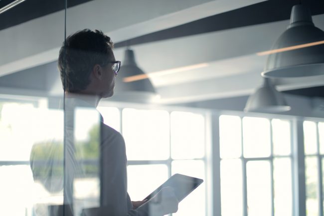 man delivers national office report at offices.net