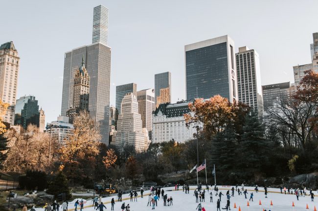 view of new york skyline from skating rink in central park at offices.net