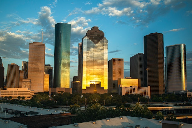 sunset view of houston cbd skyline with sunlight reflecting off office buildings image at offices.net