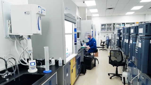 man working in a lab in the life sciences sector utilizing mixed-use office space image at offices.net