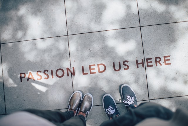 two men standing on pavement over a slogan that reads passion led us here image at offices.net