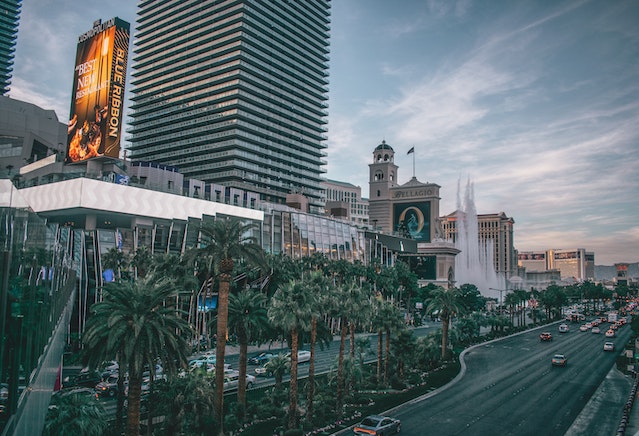 dusk view along the las vegas strip with cars and bellagio fountain in distance image at offices.net