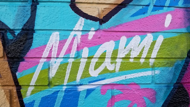 a close up of the word 'miami' in graffiti in colors and style reminiscent of 1980s fashion image at offices.net