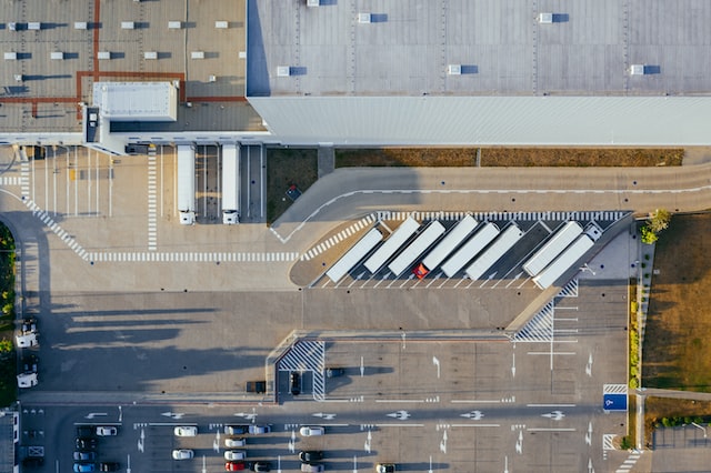 top down view of a warehouse depot with trucks arrayed out front image at offices.net