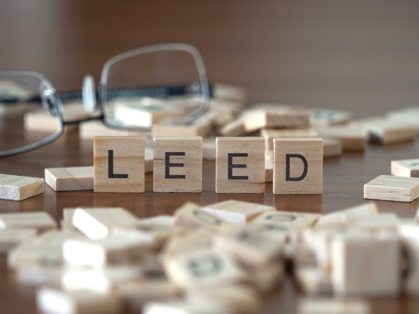 a full guide to leed certification closeup of the leed acronym spelled out upright with scrabble tiles amongst piles of other scattered scrabble tiles image at offices.net