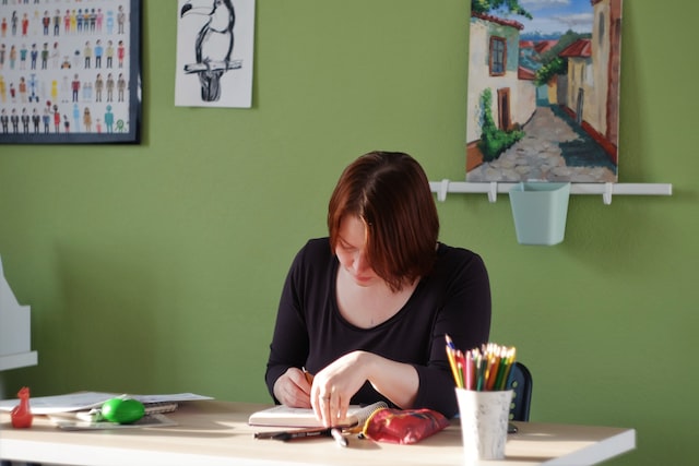 woman working in green colored office space image at offices.net